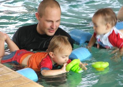 Curtis Pitt with son Tristan at a learn to swim class